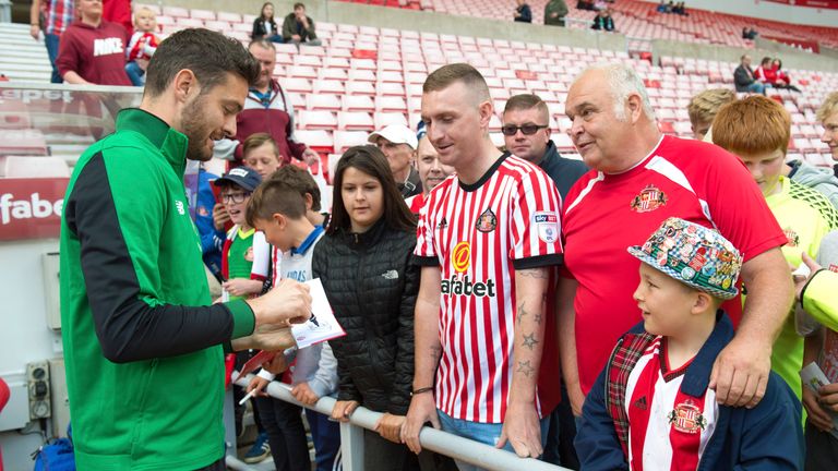 Celtic goalkeeper Craig Gordon signs autographs ahead of the game at his former stomping ground