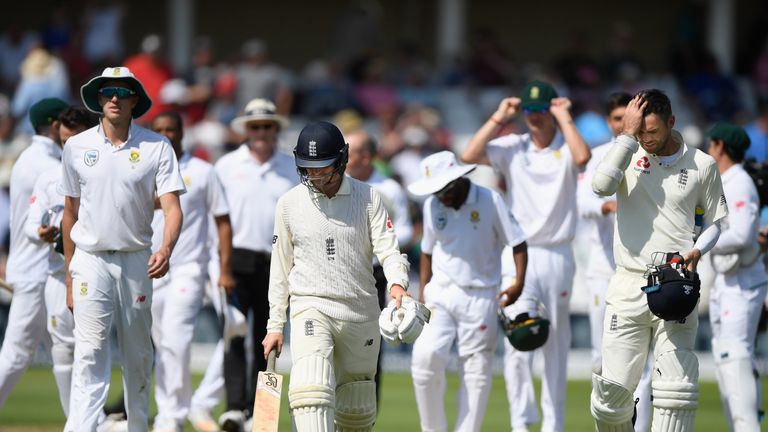 England batsmen Liam Dawson (l) and James Anderson leave the field after the fall of the last wicket after day four of the 2nd Test v South Africa