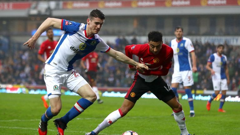 Darragh Lenihan of Blackburn Rovers and Jesse Lingard of Manchester United battle for the ball