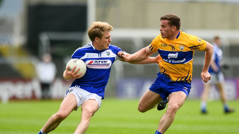 David Conway of Laois is tackled by Sean Collins of Clare during the GAA Football All-Ireland Senior Championship Round 2A match