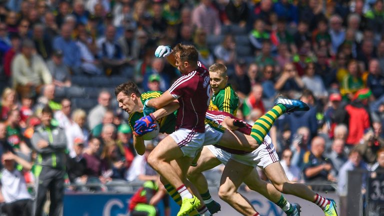David Moran of Kerry is tackled by Paul Conroy of Galway during the GAA Football All-Ireland Senior Championship Quarter-Final match 