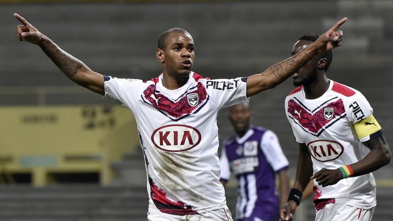 Bordeaux's Uruguyan forward Diego Rolan (L) celebrates after scoring a goal during the French L1 football match between Toulouse and Bordeaux March 21, 201