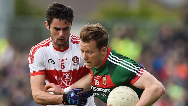 Donal Vaughan of Mayo in action against of Christopher McKaigue of Derry during the match