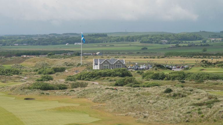 Donald Trump's International Golf Links course clubhouse is pictured behind the 18th hole, north of Aberdeen on the east coast of Scotland on June 25, 2016