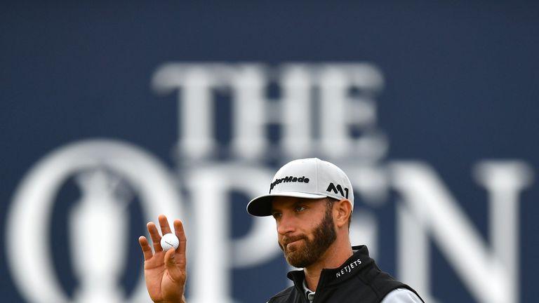 Dustin Johnson of the United States acknowledges the crowd on the 18th green during the second round of The 146th Open