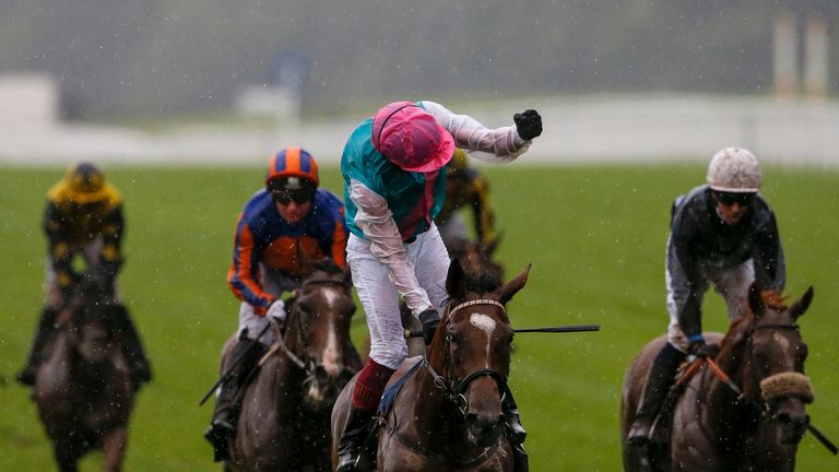 Frankie Dettori celebrates after riding Enable (C, pink cap) to win the King George VI And Queen Elizabeth Stakes