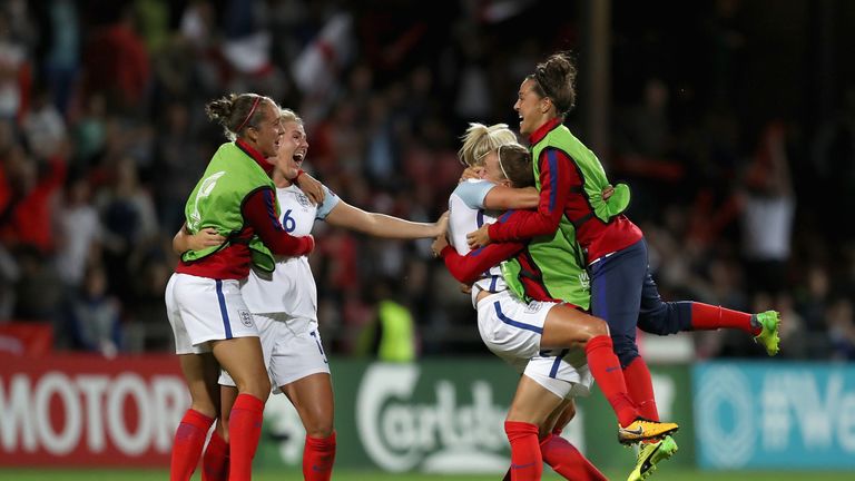  The England team celebrate beating France