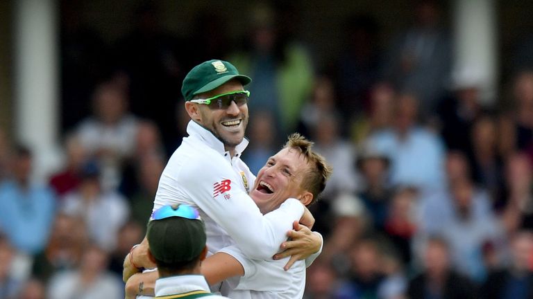 South Africa's Chris Morris (R) celebrates with South Africa's captain Faf du Plessis after taking the wicket of England's Moeen Ali