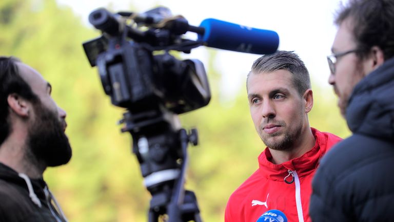 Eibar's French defender Florian Lejeune (C) speaks with journalists after a trainning session at the Atxabalpe training field of the Spanish Basque village