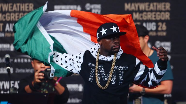 Floyd Mayweather came on stage draped in an Irish flag