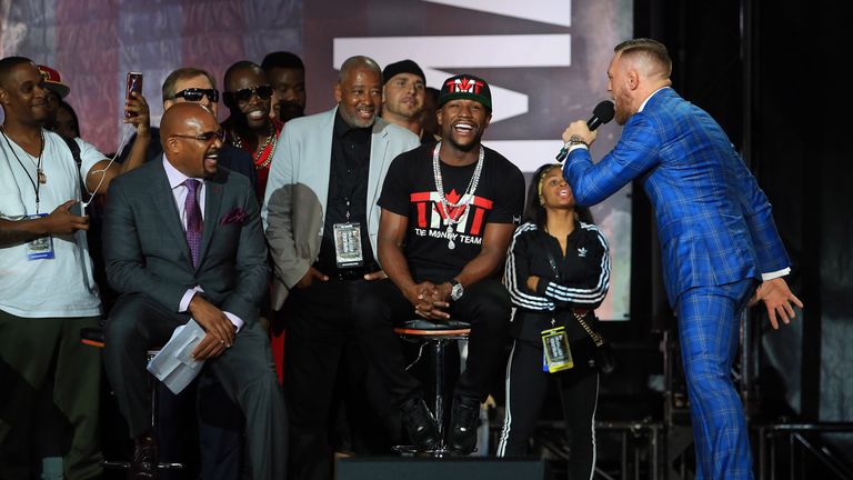 Conor McGregor speaks to Floyd Mayweather Jr. during the Floyd Mayweather Jr. v Conor McGregor World Press Tour at Budweiser Stage