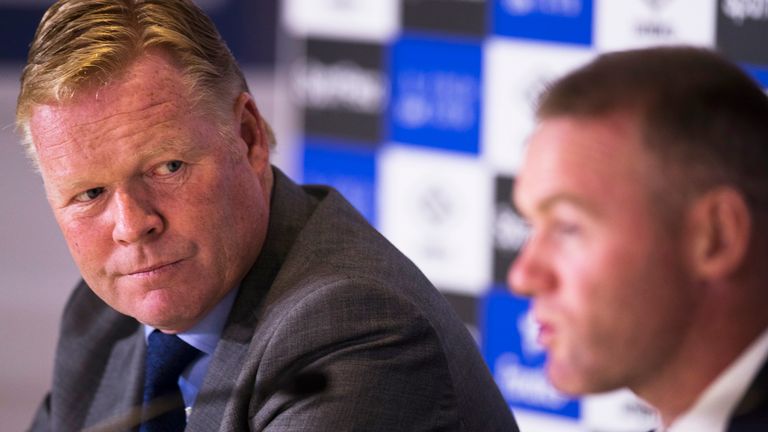 Ronald Koeman looks to Wayne Rooney while he speaks during a press conference at Goodison Park