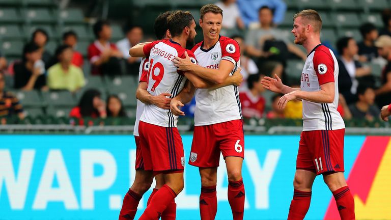 Jay Rodriguez of West Brom is congratulated by Jonny Evans after he scored against Leicester City during the Premier League Asia Trophy match in Hong Kong