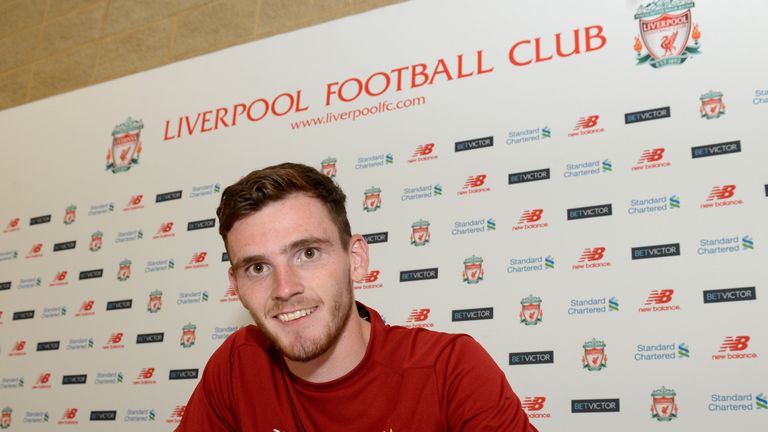Andrew Robertson signs for Liverpool at their Melwood Training Ground