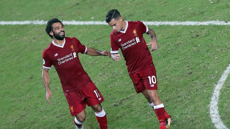 Philippe Coutinho of Liverpool reels away after scoring while Mohamed Salah runs to embrace him during the Premier League Asia Trophy final v Leicester