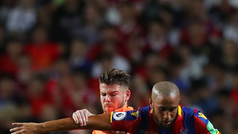Alberto Moreno competes with Andros Townsend during the Premier League Asia Trophy match between Liverpool and Crystal Palace
