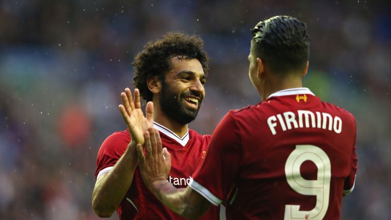 Mohamed Salah of Liverpool celebrates with Roberto Firmino after scoring their first goal during the pre-season friendly match v Wigan Athletic