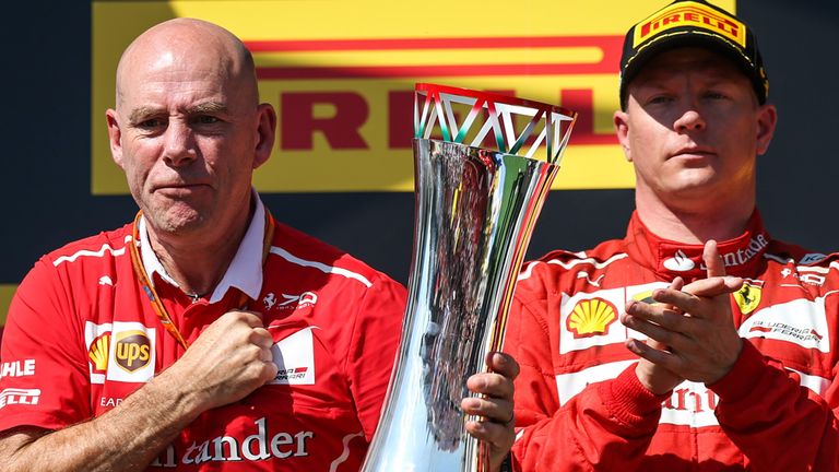 Jock Clear, Ferrari's Chief Engineer celebrates on the podium, with Raikkonen 