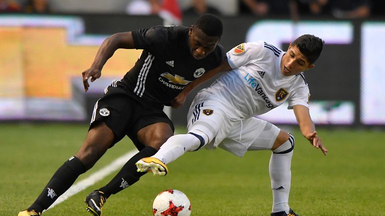 SANDY UT- JULY 17: Timothy Fosu-Mensah #24 of Manchester United and Jefferson Savarino #7 of Real Salt Lake fight for the ball in the first half of the Int