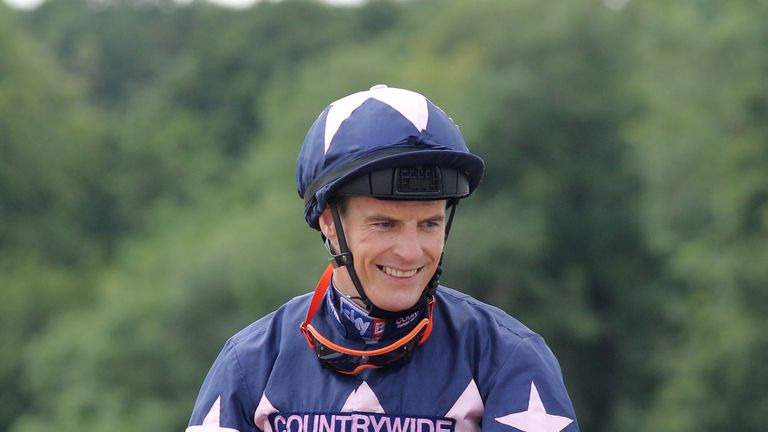 Jockey Fran Berry celebrates on London Prize ridden after winning the Betfred Northumberland Vase Handicap ahead of Graceland ridden by Louis Steward durin