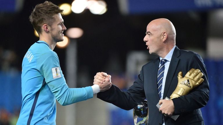 England's goalkeeper Freddie Woodman (L) recieves trophy during awards ceremony after winning U-20 World Cup final between England and Venezuela in Suwon.