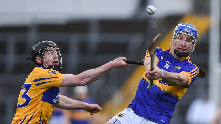 John McGrath of Tipperary in action against Shane McNamara of Clare
