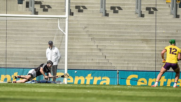 Galway goalkeeper Colm Callanan saves a penalty from Conor McDonald of Wexford during the Leinster GAA Hurling Senior Championship Final