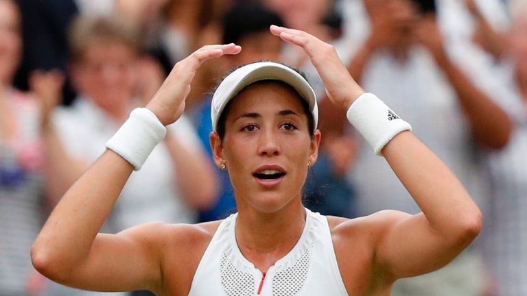 Spain's Garbine Muguruza reacts after winning against US player Venus Williams during their women's singles final match on the twelfth day of the 2017 Wimb