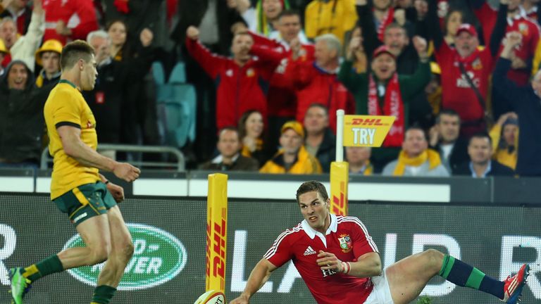 SYDNEY, AUSTRALIA - JULY 06:  George North of the Lions scores a try as James O'Connor of the Wallabies looks on during the International Test match betwee