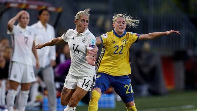 Anna Blaesse (L) of Germany battles for possession with Olivia Schough