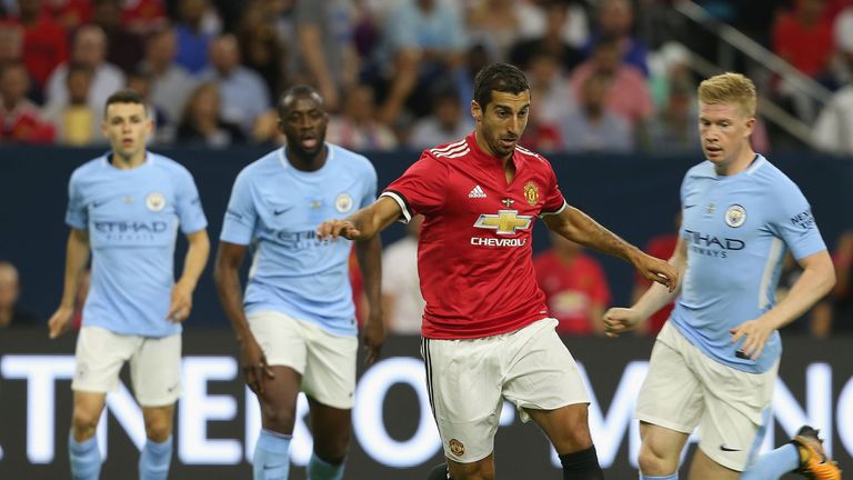 HOUSTON, TX - JULY 20:  Henrikh Mkhitaryan of Manchester United in action with Tosin Adarabioyo of Manchester City during the