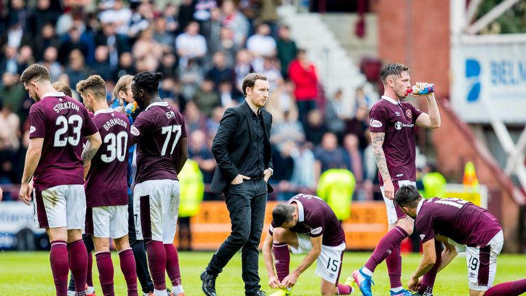 Hearts coach Ian Cathro (centre) saw his side's League Cup hopes dashed