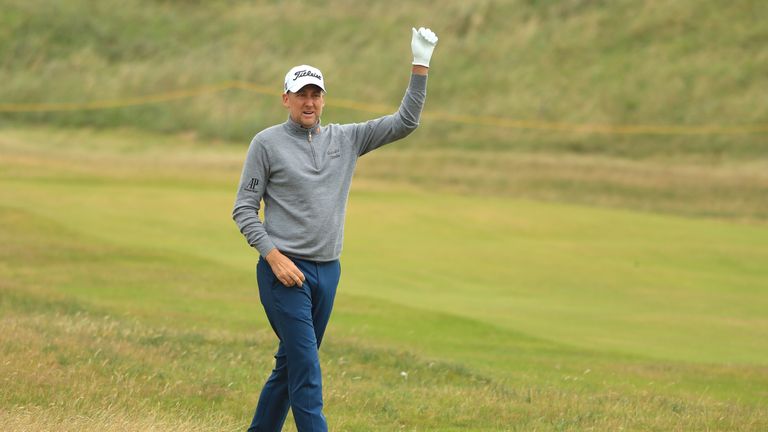 Ian Poulter of England walks down the 2nd fairway during the second round of The 146th Open 