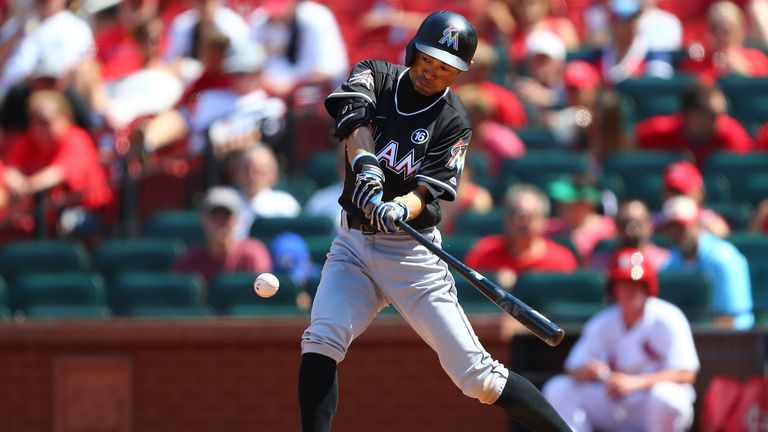 Ichiro Suzuki of the Miami Marlins sets the record for the most hits by a foreign-born player with a single against the St. Louis Cardinals
