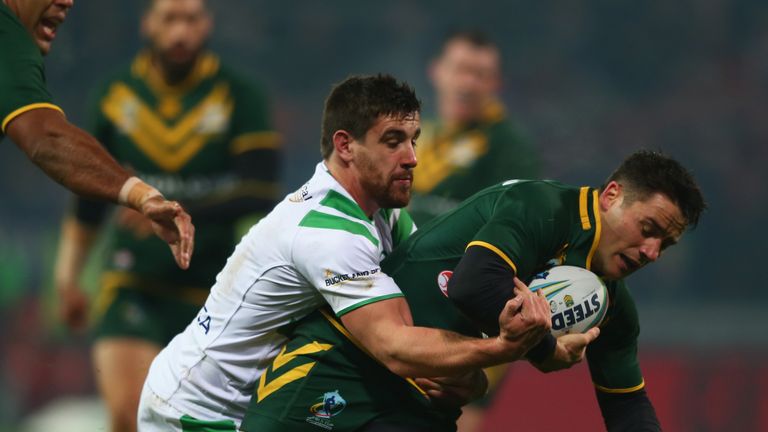 LIMERICK, IRELAND - NOVEMBER 09: Cooper Cronk (R) of Australia oon his way to scoring his sides second try as Tyrone McCarthy (L) of Ireland challenges in 