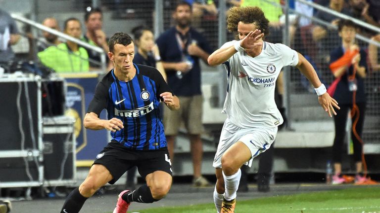 Chelsea's David Luiz (R) fights for the ball with Inter Milan's Ivan Perisic during their International Champions Cup football match in Singapore on July 