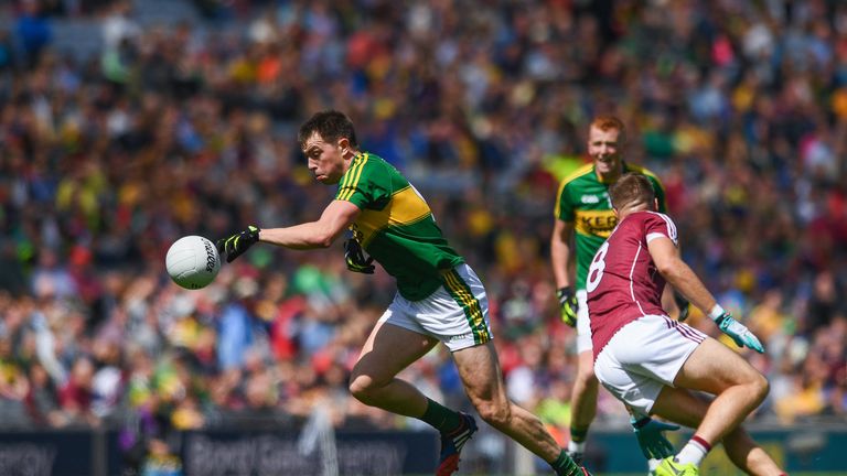 Jack Barry of Kerry beats the tackle by David Walsh of Galway during the GAA Football All-Ireland Senior Championship Quarter-Final match