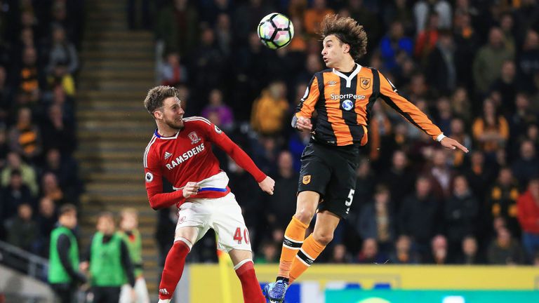 James Husband (L) vies with Lazar Markovic during a Premier League match between Hull City and Middlesbrough on April 5, 2017