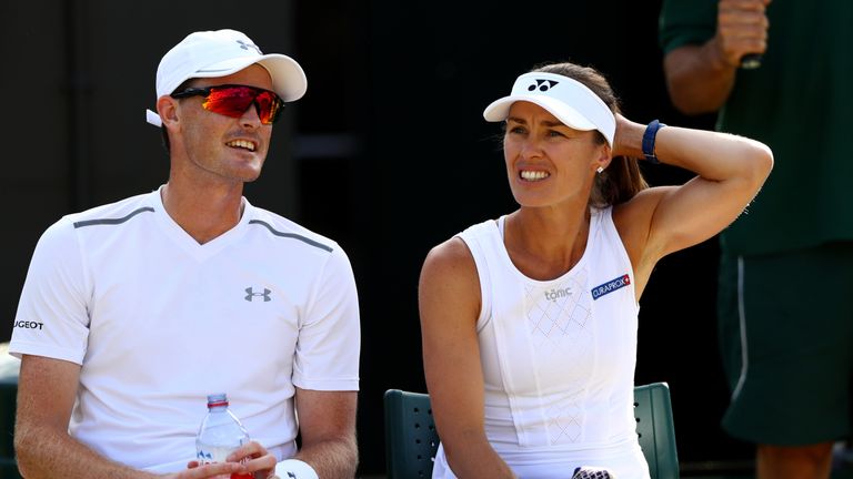 LONDON, ENGLAND - JULY 08:  Jamie Murray of Great Britain and Martina Hingis of Switzerland in discussion as they take a break during the Mixed Doubles sec