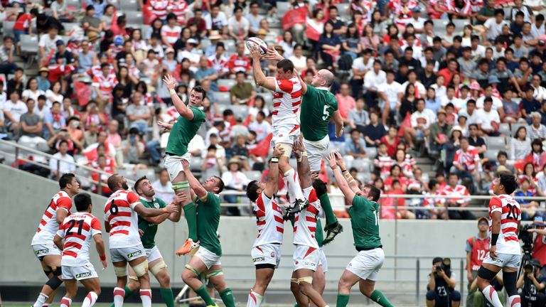 Japan's lock Luke Thompson (C, top) fights for the ball against Ireland's lock Devin Toner (R, top, #5) during their rugby union Test match in Tokyo on Jun