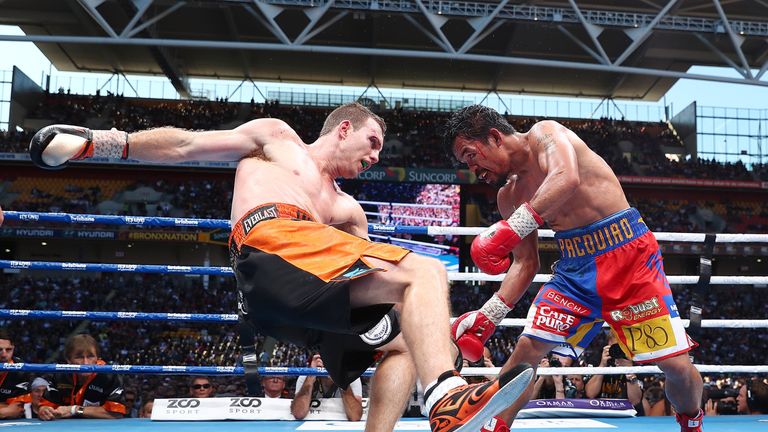 BRISBANE, AUSTRALIA - JULY 02:  Manny Pacquiao of the Philippines punches Jeff Horn of Australia during the WBO World Welterweight Title Fight  at Suncorp 