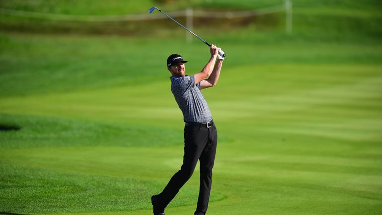 HAMBURG, GERMANY - JULY 28:  Jimmy Walker of the United States plays his second shot on the 13th fairway during the Porsche European Open - Day Two at Gree