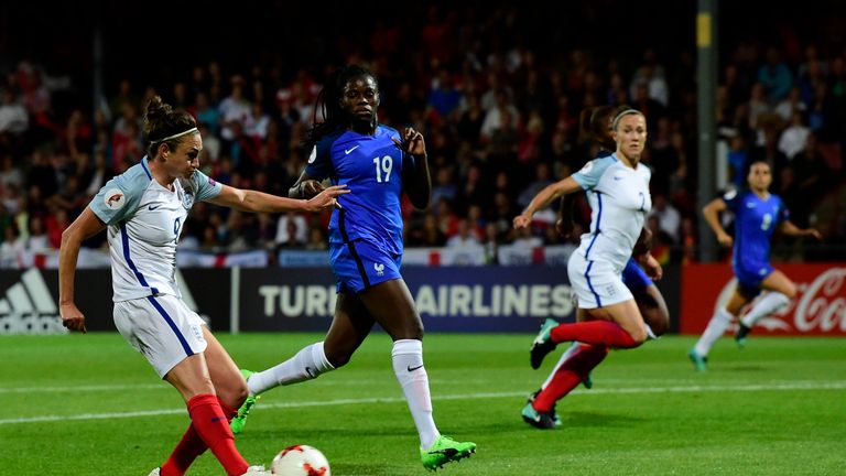 England's forward Jodie Taylor (L) shoots and scores a goal  during  the  UEFA Women's Euro 2017 tournament quarter-final football match between England an