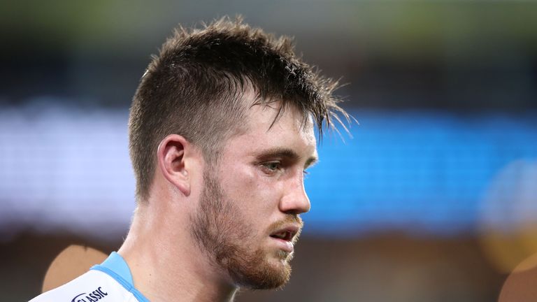 SYDNEY, AUSTRALIA - JUNE 16:  Joe Greenwood of the Titans leaves the field after receiving a head knock during the round 15 NRL match between the South Syd