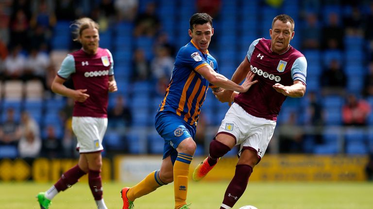 John Terry, making his first appearance for Aston Villa, battles with Louis Dodds of Shrewsbury during the Championship side's pre-season defeat