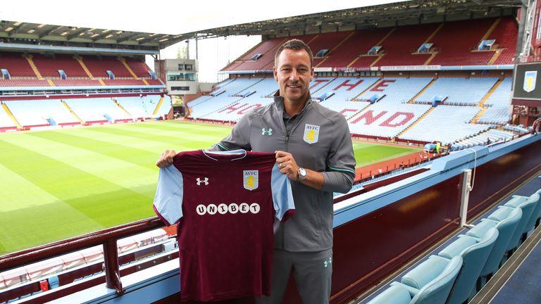 New signing John Terry poses during his unveiling at Villa Park