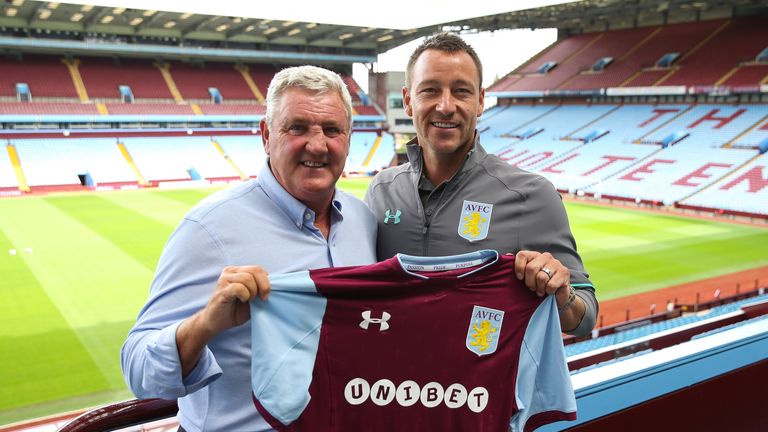 New signing John Terry and manager Steve Bruce pose for a photo at Villa Park