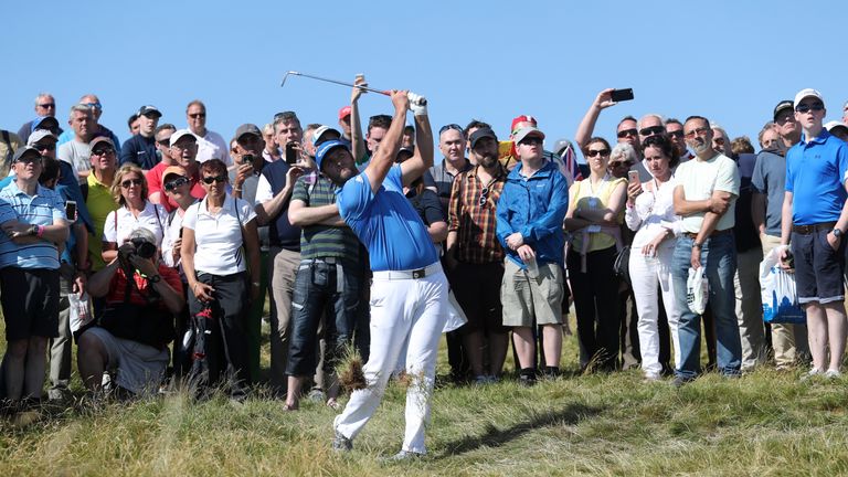 Jon Rahm of Spain hits from the rough on the 17th hole during day three of the Dubai Duty Free Irish Open at Portstewart