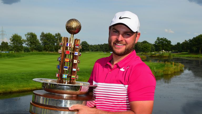 HAMBURG, GERMANY - JULY 30:  Jordan Smith of England poses with the trophy after winning the Porsche European Open during the Porsche European Open - Day F
