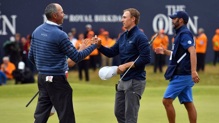 US golfer Jordan Spieth (C) shakes hands with US golfer Matt Kuchar on the 18th green after their final rounds on day four of the 2017 Open Golf Championsh